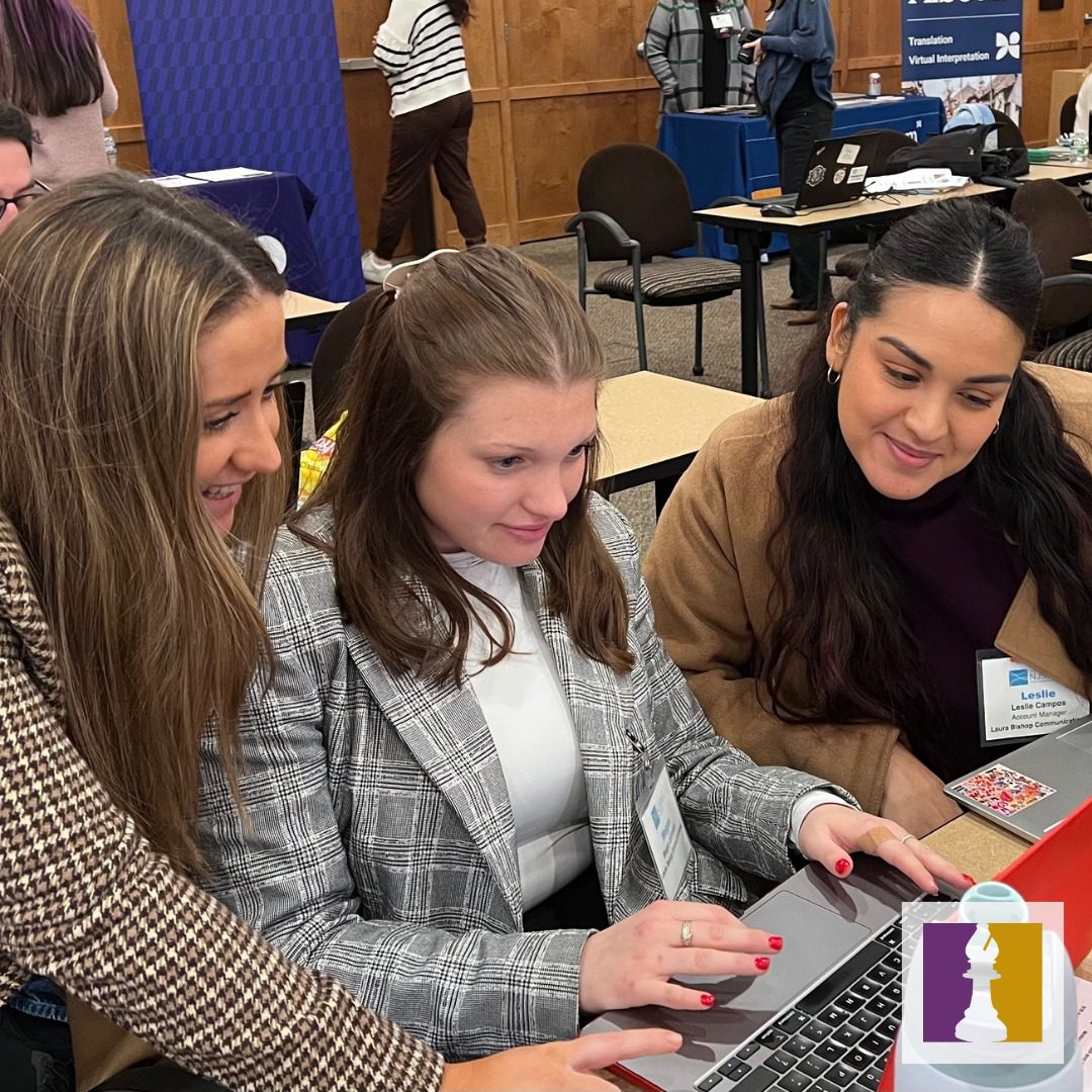 lbc staff members working on a computer