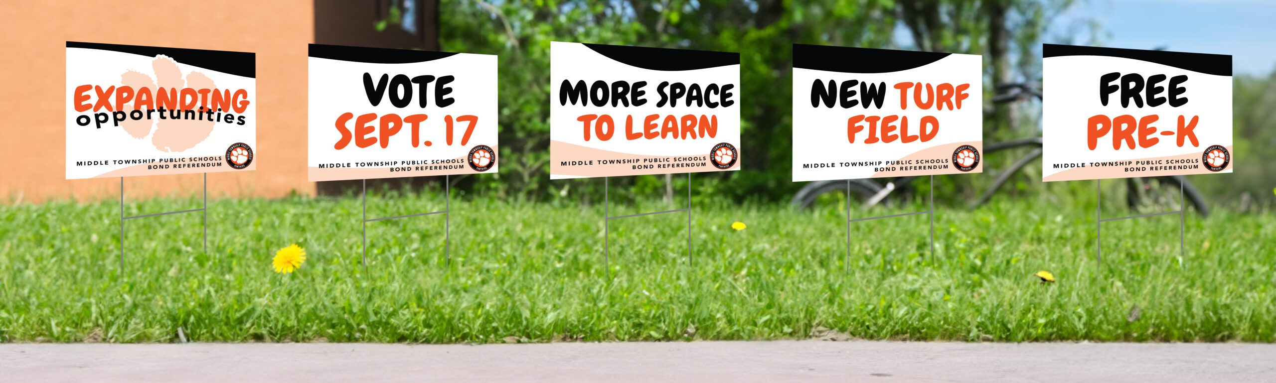 MTPS_Yard-Signs-Mockup Yard sign design on a sidewalk edge<br />