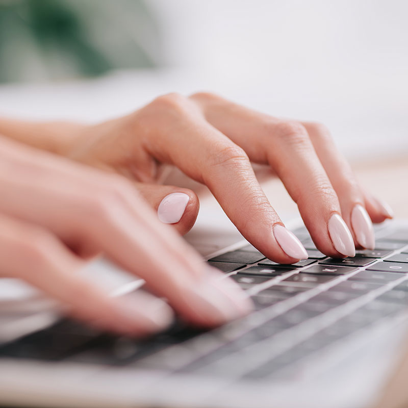 Woman Typing on Keyboard